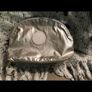 Kipling make-up bag in gold metallic color